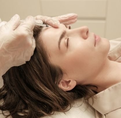 Practitioner applying polynucleotides for skin rejuvenation during a specialist training session.